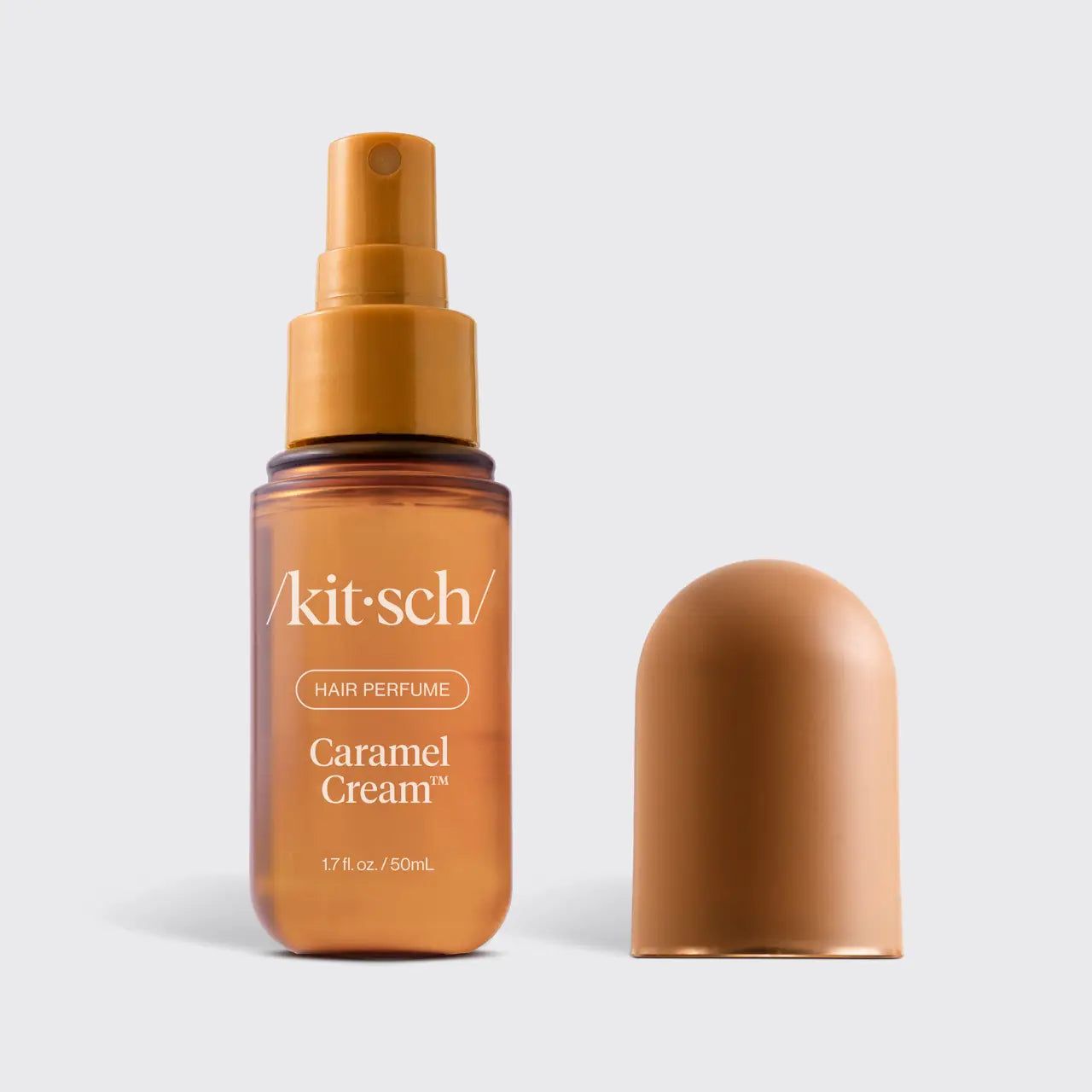 Kitsch Caramel Cream Hair Perfume with lid off against a white background