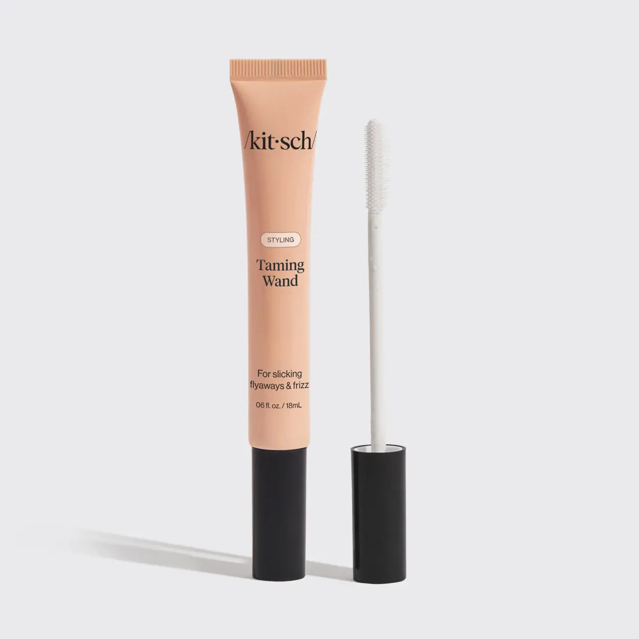 Kitsch tanning wand with applicator on a white background