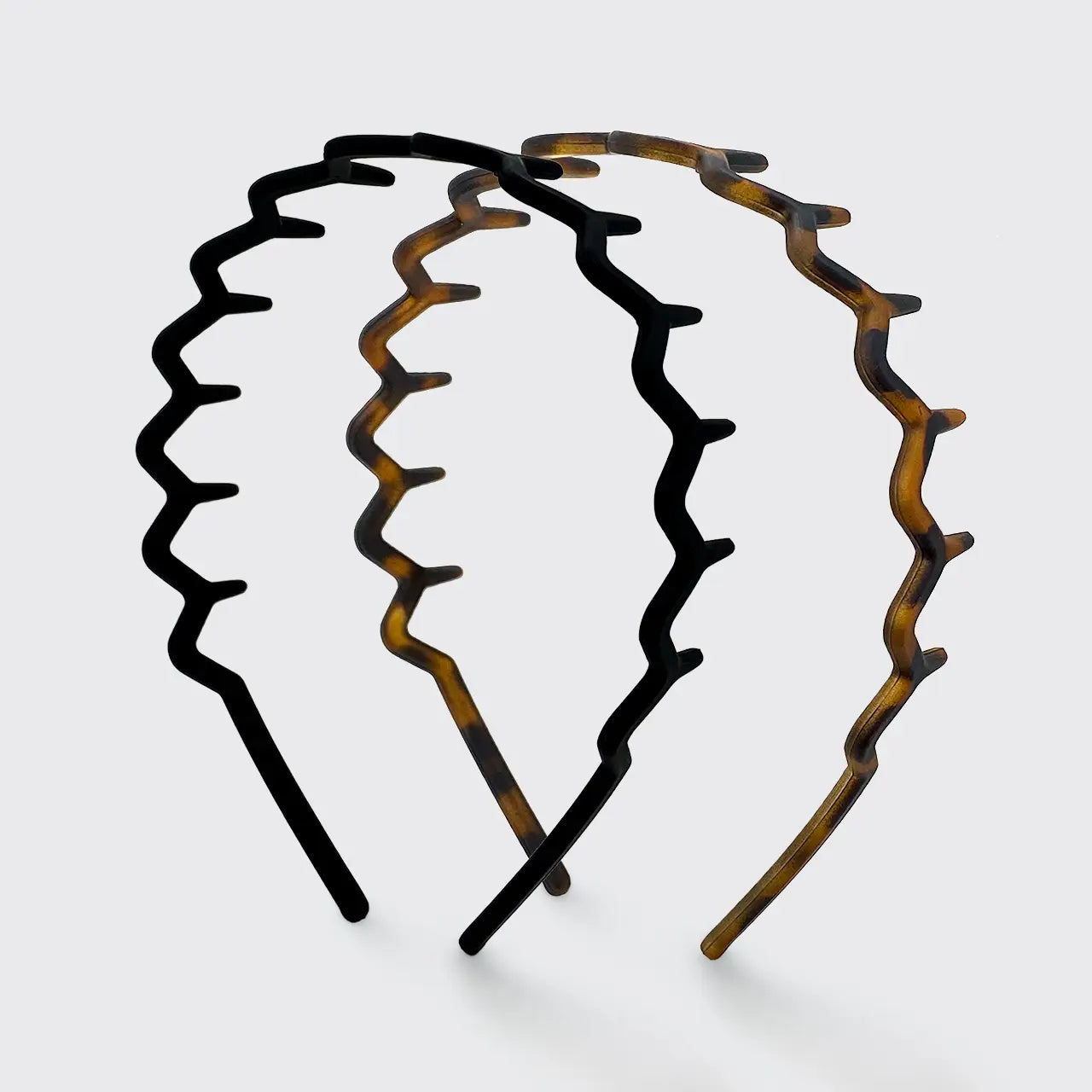 Set of two Zig Zag headbands on a white background