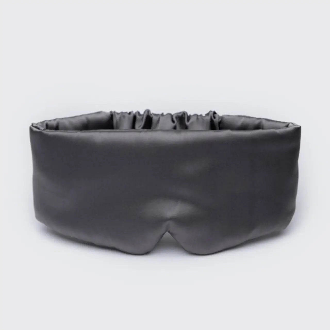 Black sleep mask on a light gray background