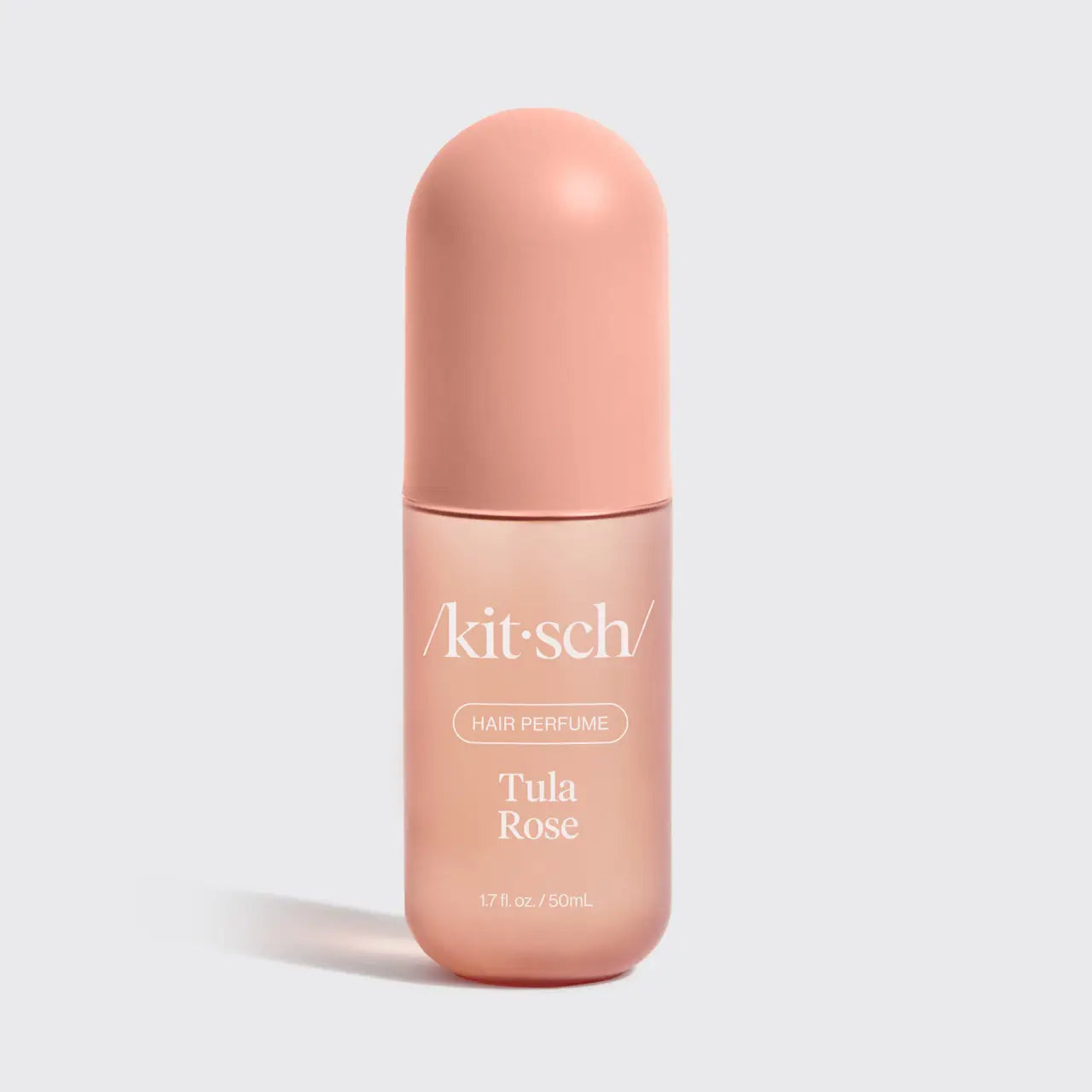 Kitsch Tula Rose hair perfume bottle on a light gray background