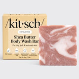 Kit Sch shea butter body wash bar with packaging on a light gray background