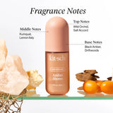 Kitsch Amber Shores hair perfume bottle with fragrance notes labels on a natural background
