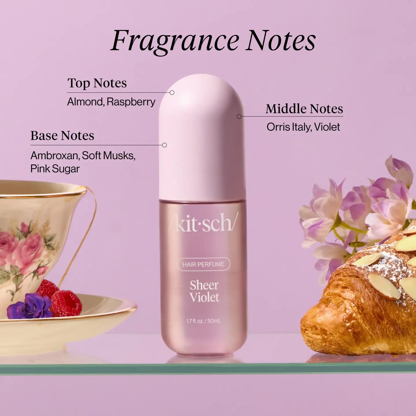 Kit-sch Sheer Violet hair perfume bottle with fragrance notes on a pink background