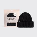 A black ribbed knit beanie hat displayed next to its light pink packaging pouch. The packaging features the brand name 'kit-sch' and the text 'Glazey Satin-Lined Beanie'.