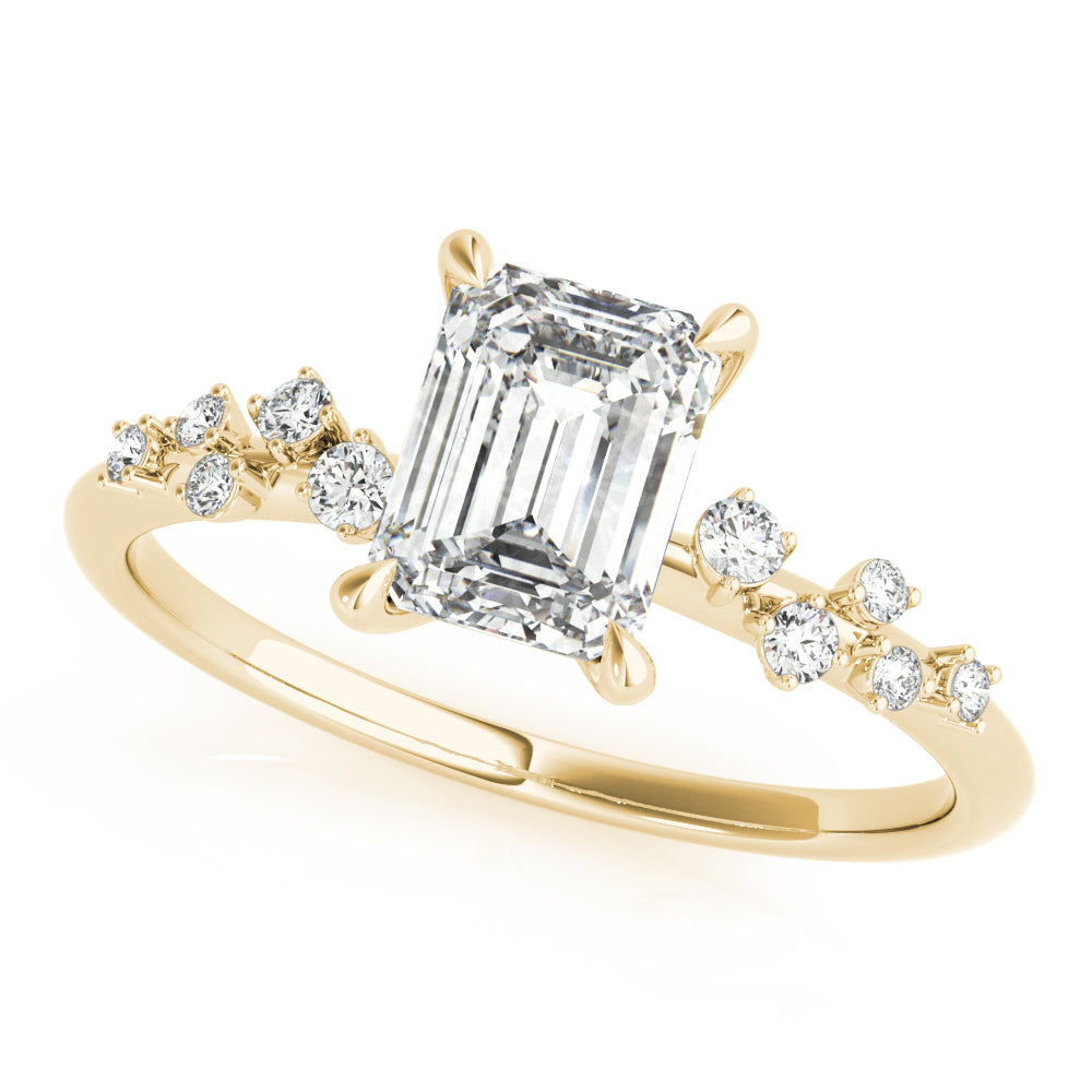 Gold ring with emerald-cut diamond and smaller diamonds on a white background