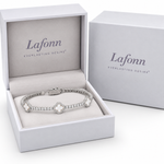 Lafonn flexible tennis bracelet with mother-of-pearl good-luck symbols displayed in a Lafonn jewelry box.