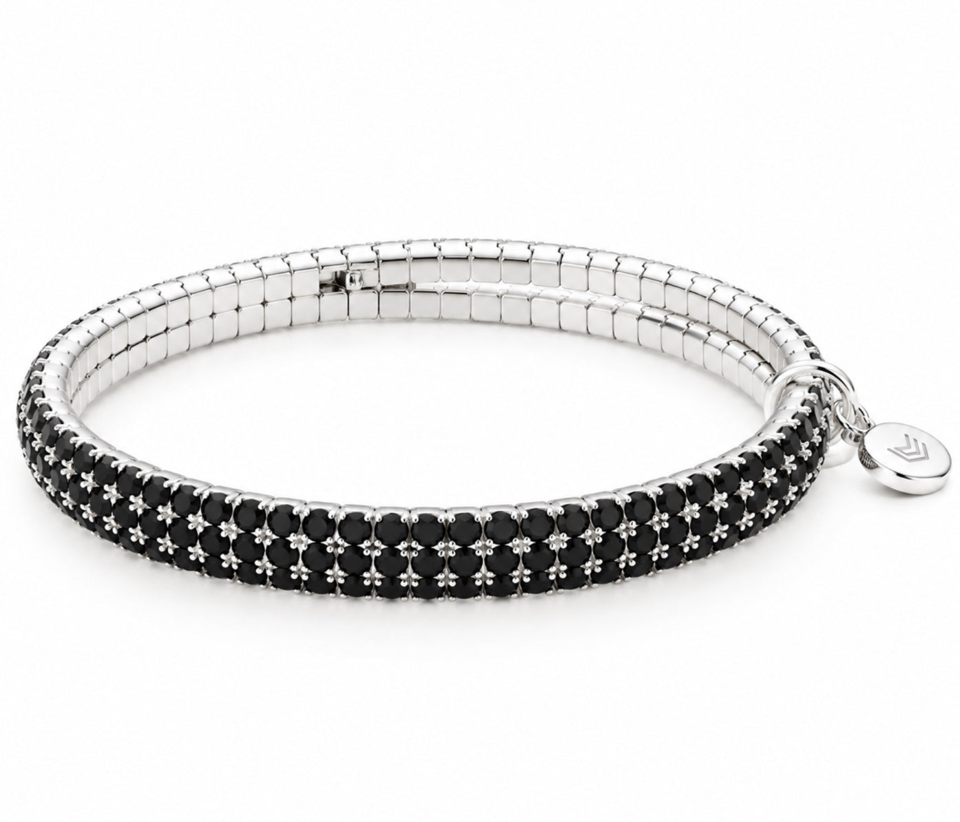Lizas Hanson Jet Bracelet features shimmering jet black accents with a polished silver-tone finish in a comfortable multi-row flexible bangle design.