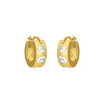 Gold FYB crystal huggie hoop earrings with clear CZ accents on a white background.