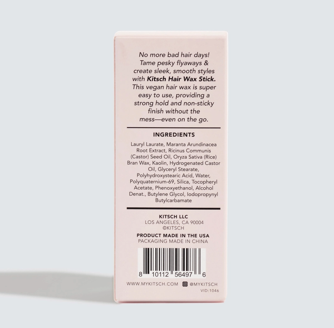 The back of a light pink KITSCH Hair Wax Stick box, showing product information, ingredients, barcode, and website on a white background.