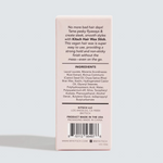 The back of a light pink KITSCH Hair Wax Stick box, showing product information, ingredients, barcode, and website on a white background.