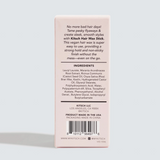 The back of a light pink KITSCH Hair Wax Stick box, showing product information, ingredients, barcode, and website on a white background.