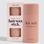 Kit Sch Flyaway Taming Hair Wax Stick in a dusty pink cylindrical container next to its matching light pink packaging box, on a clean light gray background.