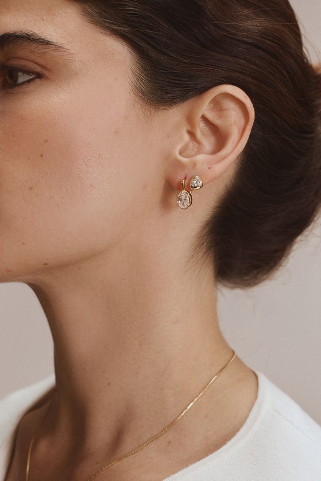 FYB Jewelry Sondra gold cubic zirconia stud earrings worn in a layered ear look