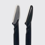 Two black grooming razors with silver metal blades, shown side-by-side against a light gray background.