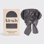 Gray satin bonnet with 'kit-sch' packaging on a light gray background