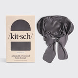 Gray satin bonnet with 'kit-sch' packaging on a light gray background