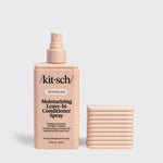 Kitsch Detangling Moisturizing Leave-In Conditioner Spray bottle in a warm peach-beige color, shown next to a matching rectangular box of sprays on a light gray background.
