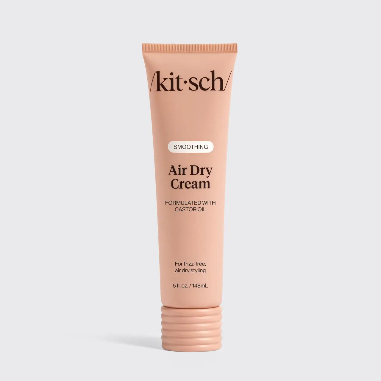 Kit-sch Air Dry Cream tube on a light gray background