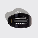 Black and gray hair dryer with 'kitsch' branding on a light gray background