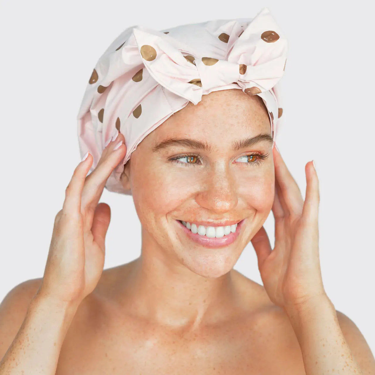 Woman with Pink Luxury Shower Cap with a white backround.