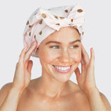 Woman with Pink Luxury Shower Cap with a white backround.