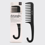Black wide-tooth comb with packaging on a light gray background