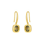 Gold dangle earrings with oval olive green stones and French hook ear wires on a white background.